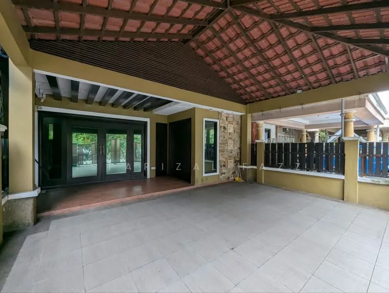 Exterior type: detached bungalow; features: terracotta tiled roof, exposed wooden beams, stone cladding on one wall, large glass sliding doors, open patio area, grey tiled flooring, surrounded by greenery, covered outdoor space; style: modern.