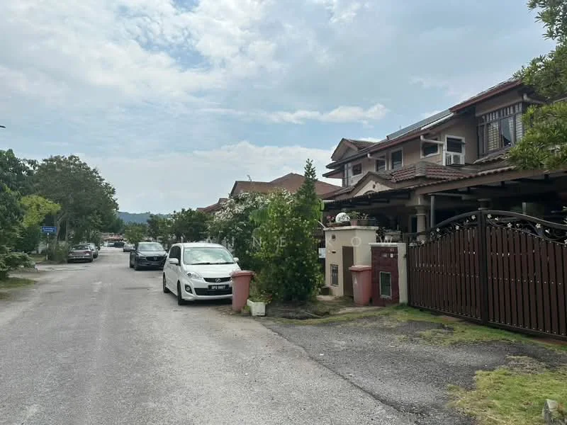 Exterior type: linked terrace house; features: two-storey linked terrace houses, red brick facade, pitched tile roof, manicured lawn, mature trees, driveway with interlocking pavers, fenced front yard, street view with parked cars, surrounded by greenery; style: modern.