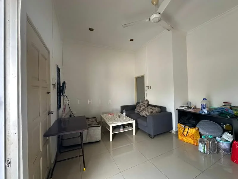 Living features: grey fabric sofa, white coffee table, wall-mounted TV, flat-panel TV stand, white tiled flooring, white painted walls, ceiling fan, recessed downlights, decorative cushions, open shelving unit, plastic storage bins, bottled water, small table, doorway to another room; style: minimalist.