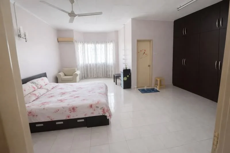 Bedroom features: queen-size bed with floral bedding, white tiled flooring, light pink painted walls, ceiling fan, floor-to-ceiling window with sheer curtains, built-in wardrobe with dark wood finish, armchair in cream fabric, small stool, door leading to hallway; style: modern.