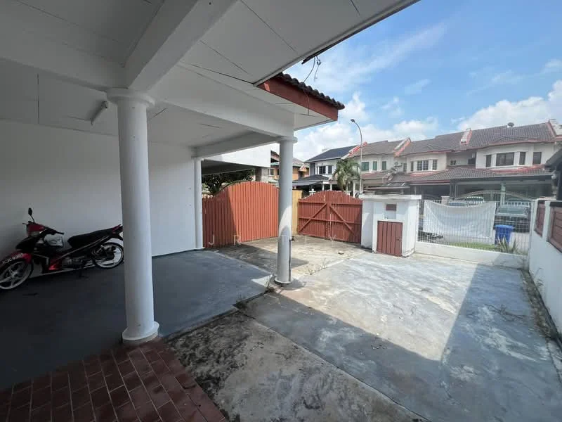 Exterior type: linked terrace house; features: covered car porch, concrete flooring, red wooden gate, white perimeter wall, visible neighboring houses, driveway, pillar supports, outdoor space, partially shaded area, fenced area; style: modern.