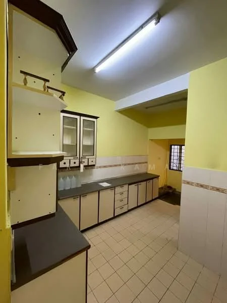 Kitchen features: yellow painted walls, white tiled backsplash, laminate countertop, built-in cabinets with glass doors, open shelving, floor tiles, single-bowl sink, wall-mounted lighting, window for natural light.