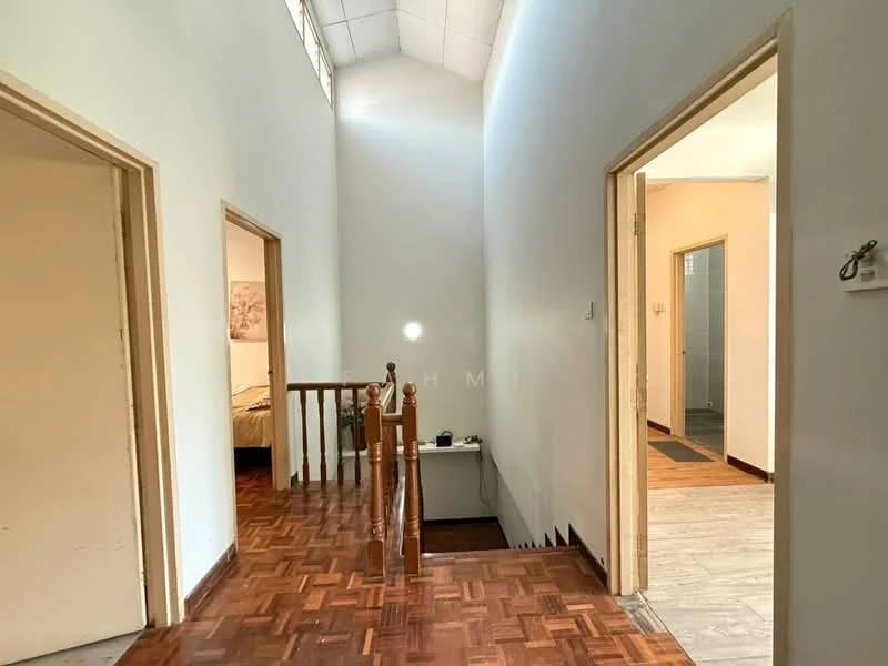 Room features: wooden flooring, white painted walls, high ceiling, staircase with wooden railing, doorways leading to other rooms, natural light from windows, light-colored door frames, tile flooring in adjacent room; style: modern.