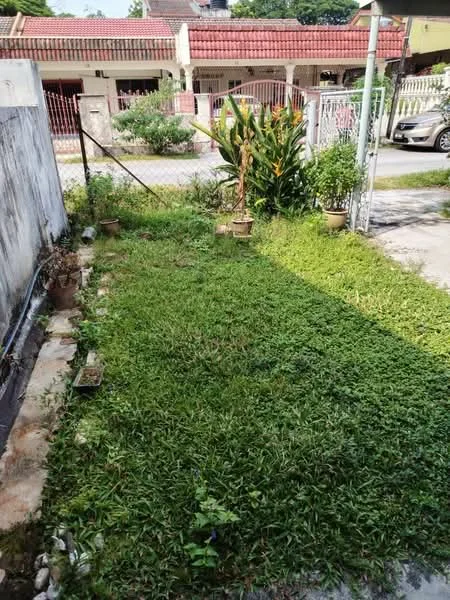 Exterior features: manicured lawn, fenced yard, potted plants, pathway with stones, surrounded by greenery, driveway visible, adjacent to residential street.