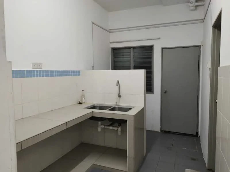Kitchen features: double-bowl stainless-steel sink, chrome pull-down faucet, grey tiled countertop, white tiled backsplash, white painted walls, grey floor tiles, window with horizontal slats, door leading to hallway.