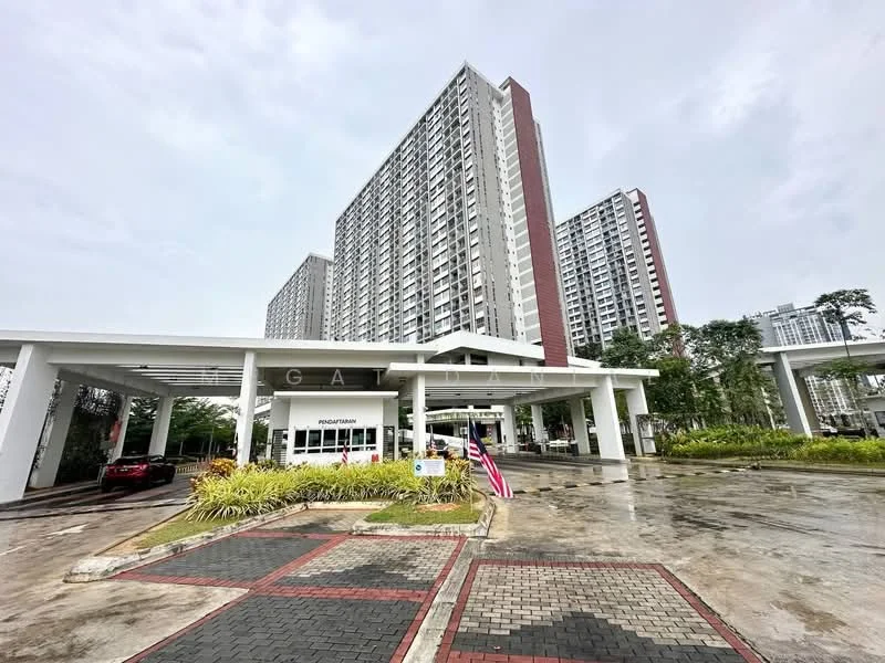 Exterior type: high-rise condominium; features: modern facade with glass and concrete, multiple storeys, covered entrance, landscaped garden with shrubs, paved driveway, flagpole with Malaysian flag, parking area, surrounded by greenery; style: modern.