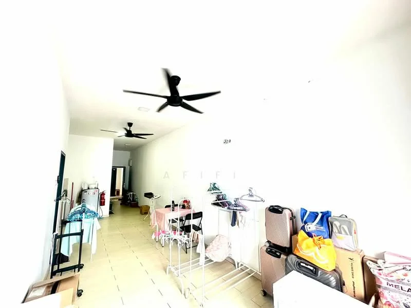 Room features: white painted walls, tile flooring, 2 ceiling fans, clothes racks, luggage, folding tables, various bags, open layout.