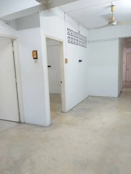 Room features: white painted walls, concrete flooring, ceiling fan, doorway leading to another room, doorway leading to hallway, decorative wall feature with cut-out design, light switch, wall-mounted electrical outlet; style: minimalist.