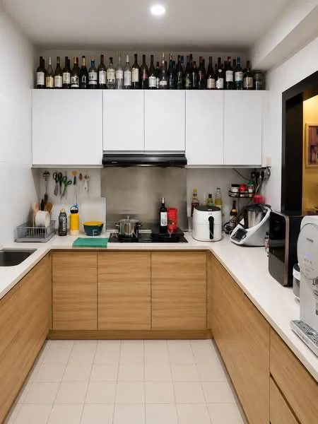 Kitchen features: white upper cabinets, wooden lower cabinets, white countertop, stainless-steel sink, chrome pull-down faucet, built-in stove, exhaust hood, microwave, kettle, toaster, various bottles on shelf, kitchen utensils, tile flooring, recessed lighting; style: modern.