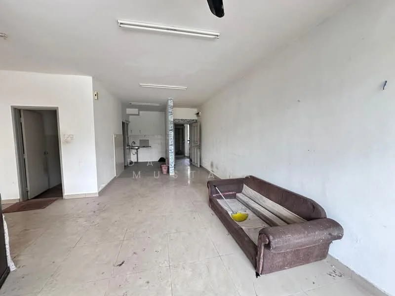 Living features: white painted walls, tiled flooring, ceiling lights, sofa with fabric upholstery, open layout, doorway leading to another room, kitchen area visible in background, window with no visible treatment.