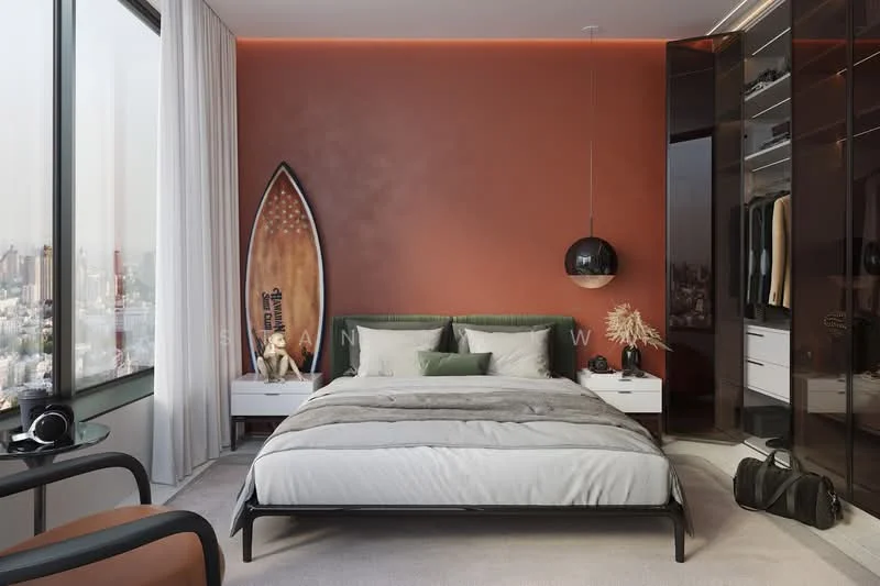 Bedroom features: king-size bed with green upholstered headboard, white bedding with grey throw blanket, two white bedside tables, black pendant light, floor-to-ceiling windows with sheer curtains, orange accent wall, light grey carpet flooring, surfboard as decor, built-in wardrobe with mirrored doors, decorative wall art, black chair, black duffel bag; style: modern; view: city.
