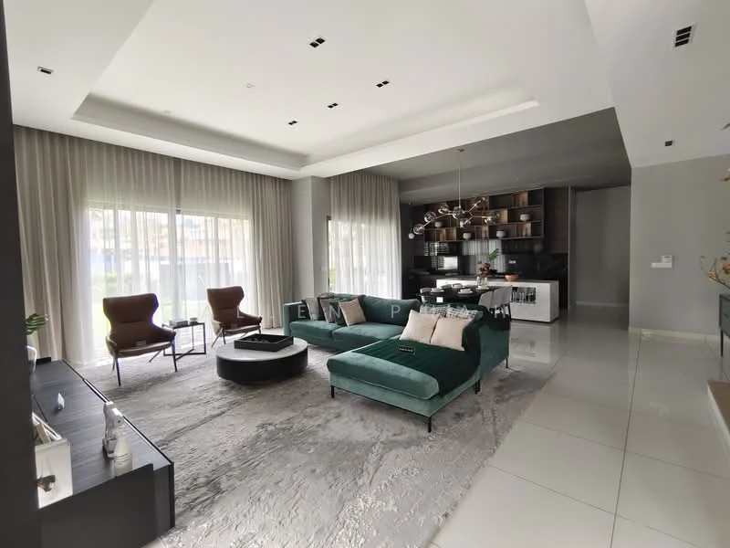 Living features: green velvet sectional sofa, 2 brown upholstered armchairs, round coffee table, area rug with neutral tones, floor-to-ceiling windows with sheer curtains, recessed downlights, tray ceiling, TV console, decorative wall shelving, open-plan layout to dining area, wall-mounted TV, decorative plants; style: modern; view: garden.