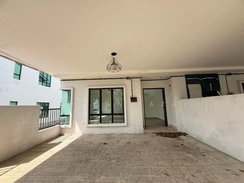 Room features: concrete flooring, white painted walls, large windows, black metal railing, hanging light fixture, open layout, no visible furniture, leaves on the floor; style: modern.