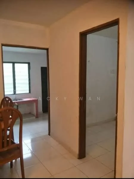 Room features: white painted walls, tile flooring, wooden door frames, window with horizontal slats, dining table with chairs, open doorway leading to another room, light fixture on ceiling.