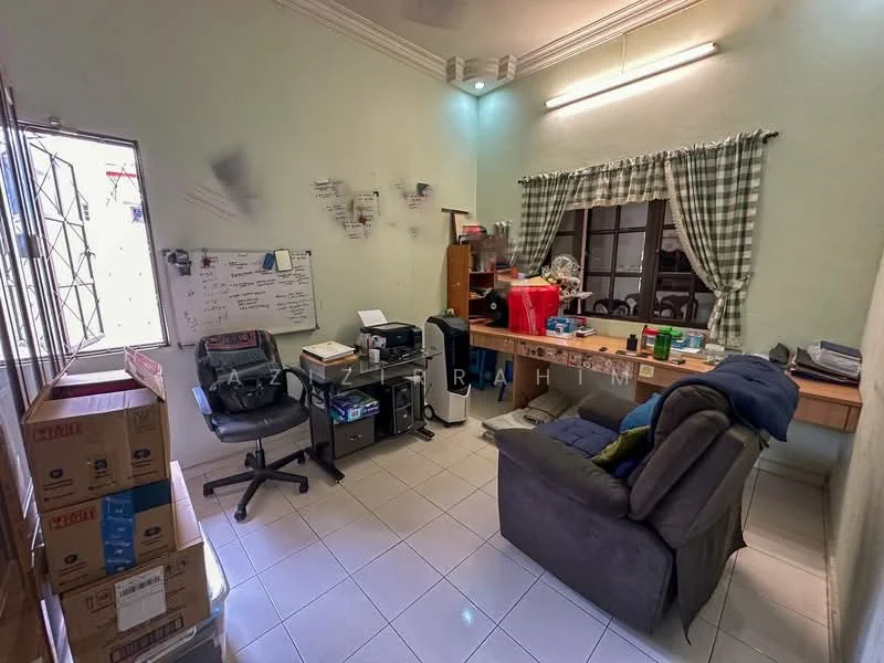 Room features: light green painted walls, white ceiling, tile flooring, large window with grid pattern, curtains with checkered pattern, wooden desk, office chair, printer, stack of boxes, sofa chair, whiteboard, shelves with various items.