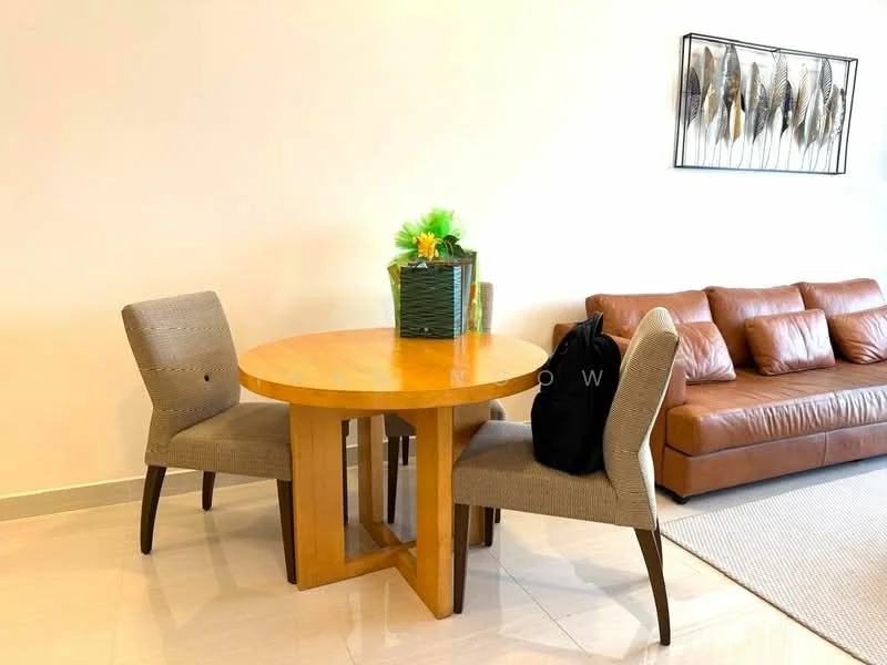 Dining features: round wooden dining table, 2 upholstered dining chairs in beige, decorative plant in a green basket, light-colored wall, cream-colored flooring, brown leather sofa in background, area rug under dining table; style: modern.