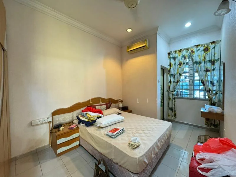 Bedroom features: queen-size bed, wooden headboard, bedside table, wall-mounted air conditioning unit, window with sheer curtains, decorative curtains with floral pattern, light-colored painted walls, tile flooring, built-in wardrobe, study desk, ceiling fan.