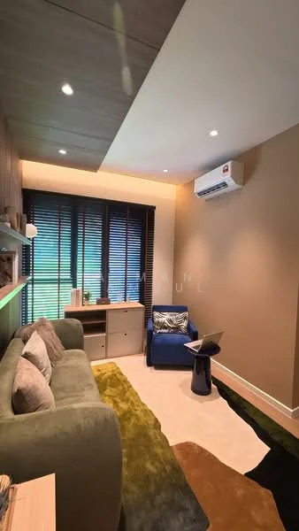 Room features: green fabric sofa, blue armchair, round side table, wooden shelving unit, recessed ceiling lights, air conditioning unit, blackout blinds, light-colored walls, light-colored flooring, decorative area rug; style: modern.