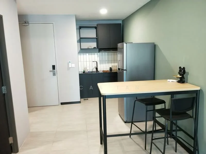 Kitchen features: grey cabinetry, white tiled backsplash, stainless-steel fridge, built-in oven, freestanding range oven, single-bowl stainless-steel sink, chrome pull-down faucet, countertop with bar seating, black metal bar stools, light grey tile flooring, green accent wall, recessed downlights; style: modern.
