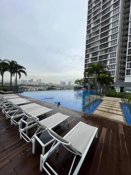 Exterior type: high-rise condominium; features: infinity pool, pool deck with loungers, surrounded by palm trees, wooden decking, city skyline view, glass railing, landscaped garden area; style: modern.
