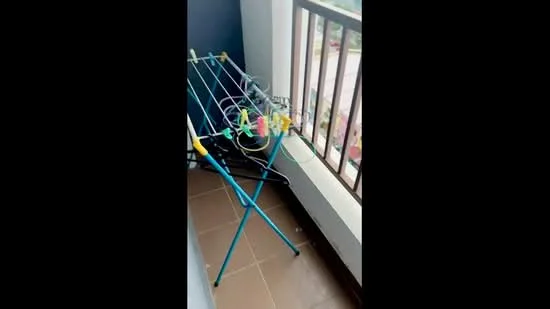 Room features: balcony, clothes drying rack, tile flooring, railing, city view; view: city.