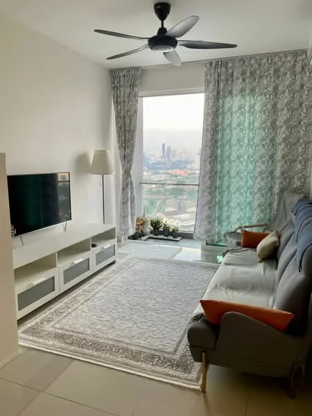 Living features: floor-to-ceiling windows, grey fabric sofa, orange accent cushions, white TV console with storage, wall-mounted TV, area rug with intricate pattern, curtains with floral pattern, ceiling fan with light, decorative plants on window sill; style: modern; view: city.