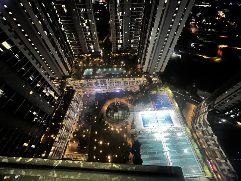 Exterior type: high-rise condominium; features: night view of the building complex, swimming pool area with lighting, basketball court, tennis court, landscaped garden, outdoor seating areas, illuminated pathways, multiple high-rise towers, surrounding urban landscape; style: modern.