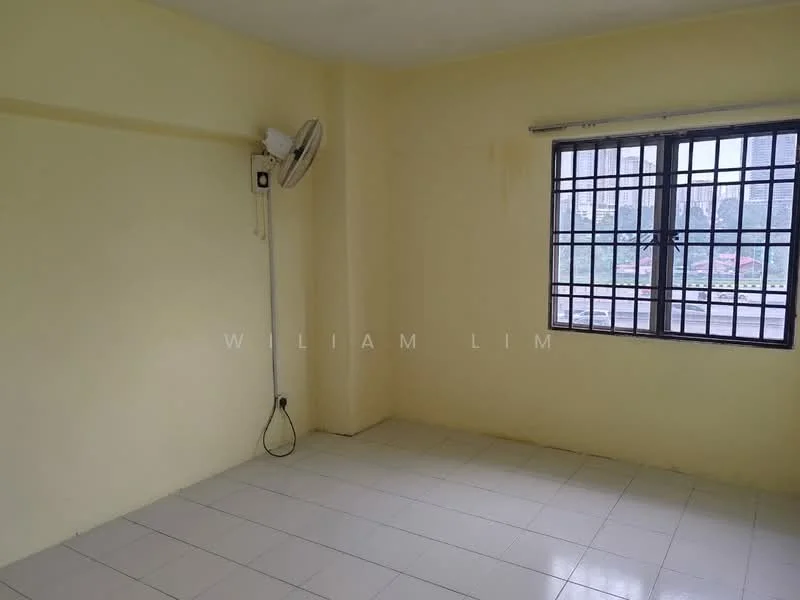 Room features: yellow painted walls, white tiled flooring, window with metal grille, wall-mounted split AC, ceiling fan, no visible furniture, natural light from window.