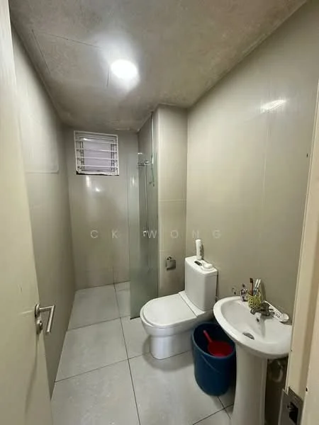 Bathroom features: white tiled walls, grey tiled flooring, walk-in shower with glass enclosure, chrome basin mixer faucet, white toilet, white pedestal sink, small window, ceiling light, cleaning bucket; style: modern.