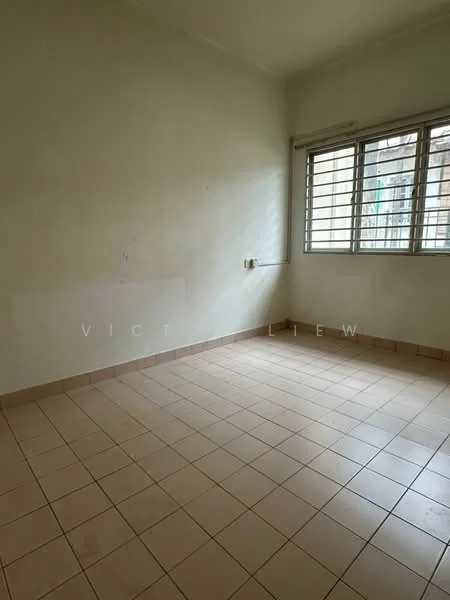Room features: white painted walls, tile flooring, grilled windows, natural light from window, corner room, no visible furniture, neutral color scheme, single window.