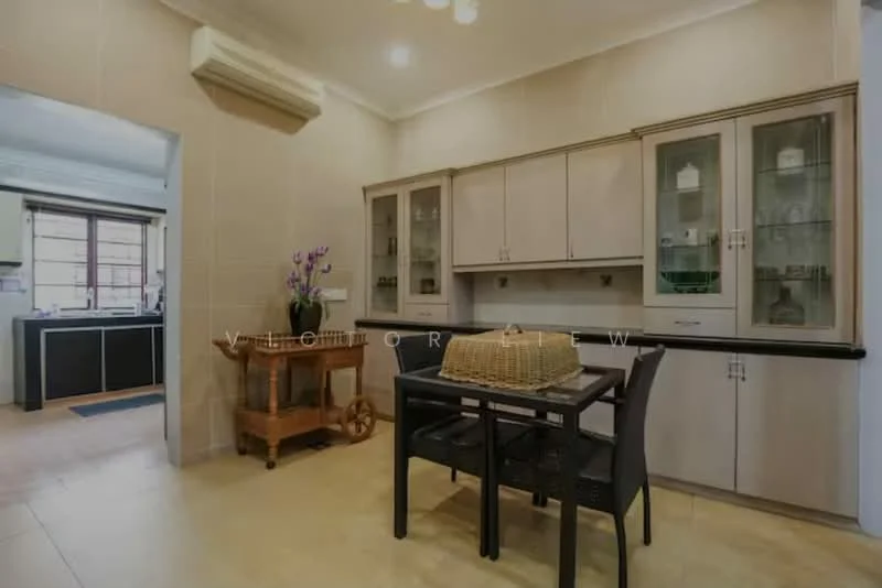 Kitchen features: cream cabinetry with glass-front upper cabinets, black countertop, stainless-steel sink, chrome pull-down faucet, built-in oven, freestanding range oven, refrigerator, tile flooring, wall-mounted air conditioning unit, pendant lighting, dining table with four black chairs, wooden cart, decorative vase with flowers; style: modern.