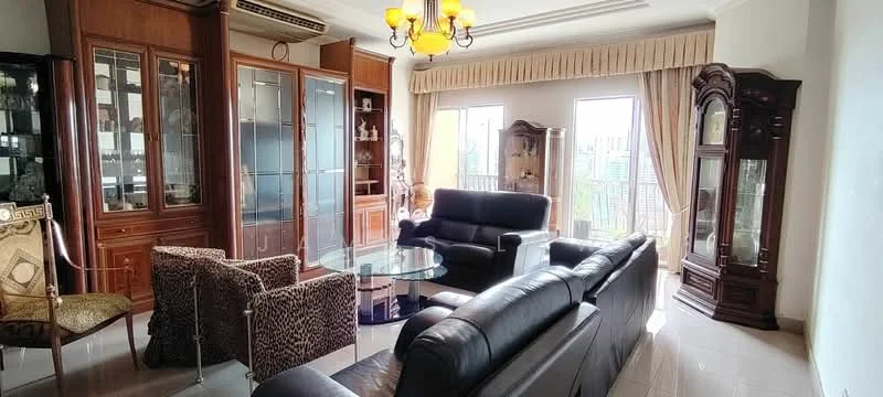 Living features: black leather sofa, 3-seater sofa, glass coffee table, wooden display cabinets, glass-fronted cabinets, decorative wooden furniture, large windows with city view, cream curtains, chandelier with multiple bulbs, tile flooring, wall-mounted air conditioning unit; style: contemporary; view: city.