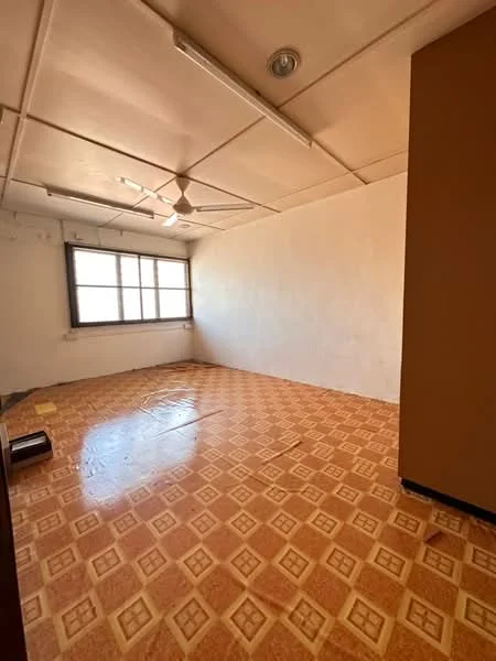 Room features: vinyl flooring with diamond pattern, white painted walls, ceiling with fluorescent lights, 1 ceiling fan, large window with natural light.