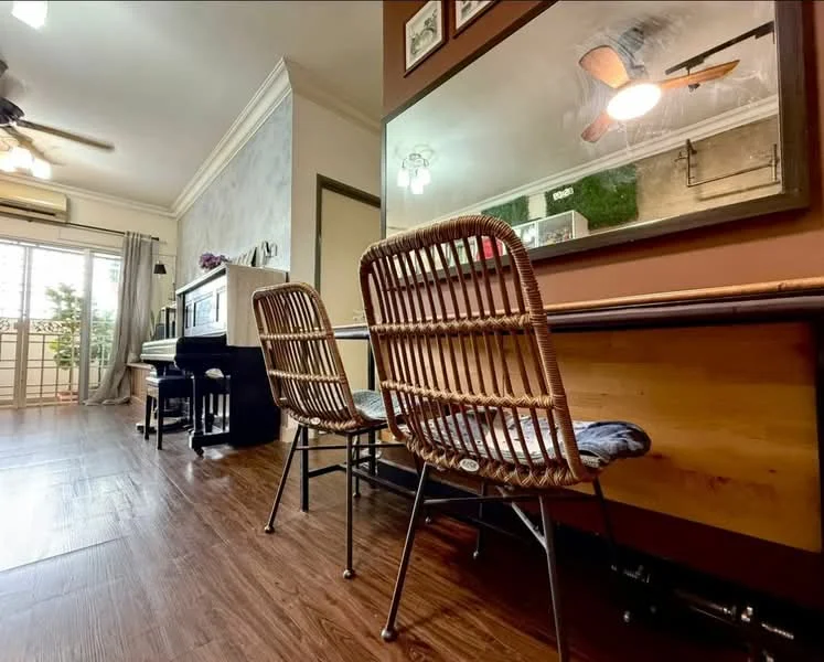 Room features: wooden flooring, ceiling fan, wall-mounted mirror, piano, two rattan chairs, decorative wall art, greenery decor, natural light from window, neutral wall color, table with wooden surface; style: modern; view: garden.