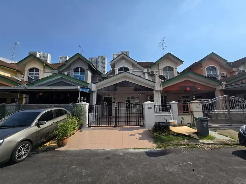 Exterior type: linked terrace house; features: two-storey linked terrace, painted facade in pastel colors, gated entrance, front porch with tiled flooring, manicured garden with potted plants, visible air conditioning units, decorative lanterns, driveway with interlocking pavers, surrounded by residential buildings, clear blue sky; style: modern.