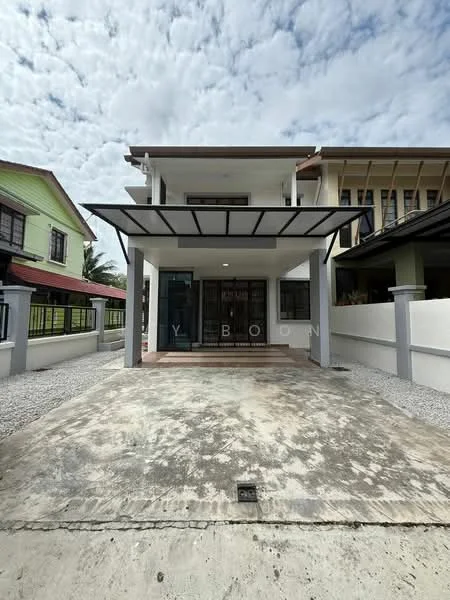 Exterior type: semi-detached house; features: flat roof with overhang, concrete driveway, gravel landscaping, front porch area, glass door entrance, metal railing, white painted facade, large windows, two-storey structure, surrounded by greenery; style: modern.
