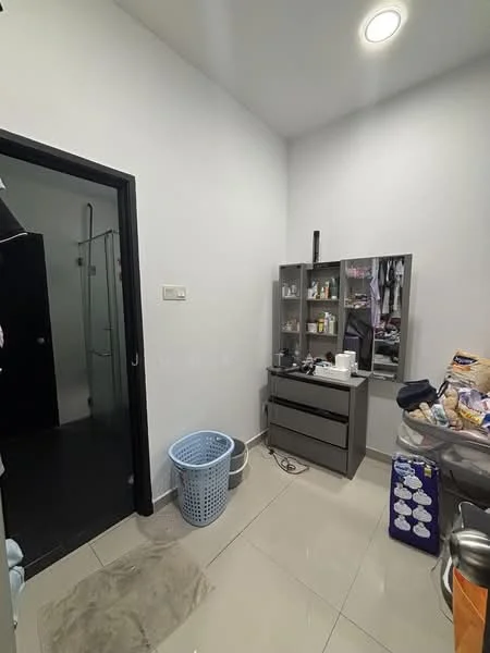 Room features: white painted walls, grey tiled flooring, recessed ceiling lights, glass shower enclosure, black door, storage cabinet, mirror, laundry basket, countertop with toiletries, plastic bags, cluttered countertop; style: modern.