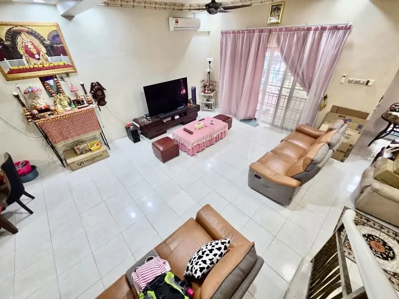 Living features: white painted walls, glossy white tile flooring, exposed wooden beams on ceiling, 5-blade ceiling fan, wall-mounted TV, brown leather reclining sofa, grey fabric sofa, pink coffee table, decorative altar with religious idols, curtains in light pink, open layout, decorative wall art, boxes for storage; style: modern.
