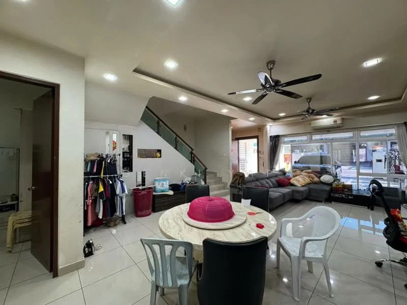 Living features: grey sectional sofa, round dining table, 4 dining chairs, white plastic chairs, ceiling fan with light, recessed downlights, large windows with sheer curtains, tile flooring, staircase leading to upper floor, wall-mounted air conditioning unit, decorative wall with clothing rack, open layout to dining area; style: modern.