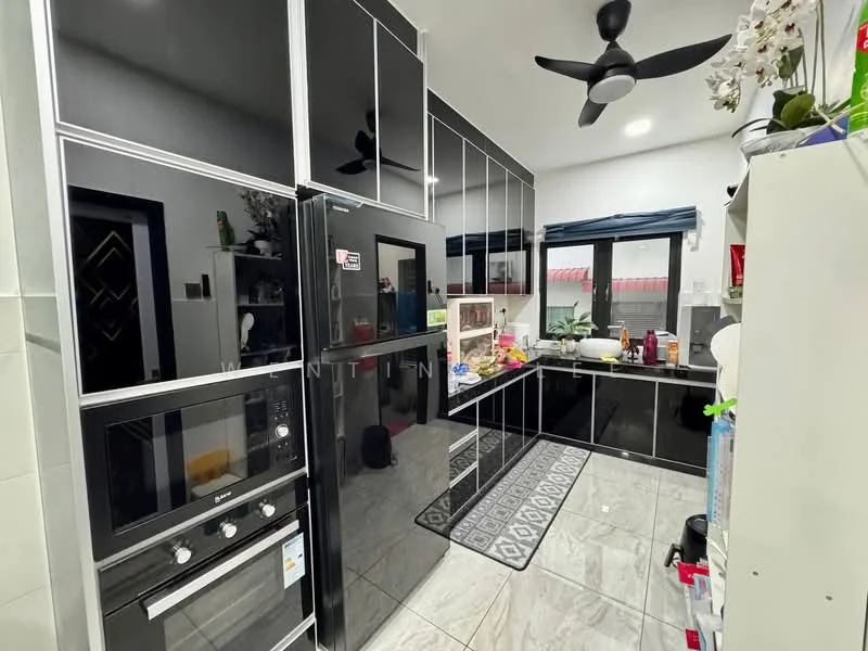 Kitchen features: black glossy cabinetry, built-in oven, stainless-steel fridge, ceramic tile flooring, grey patterned area rug, black countertop, double-bowl stainless-steel sink, chrome pull-down faucet, wall-mounted ceiling fan, window with blue curtains, open shelving, decorative plants; style: modern.