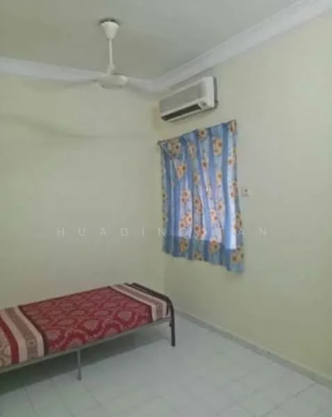 Bedroom features: single bed, red patterned bedspread, white walls, ceiling fan, wall-mounted split AC, curtains with floral pattern, tile flooring.