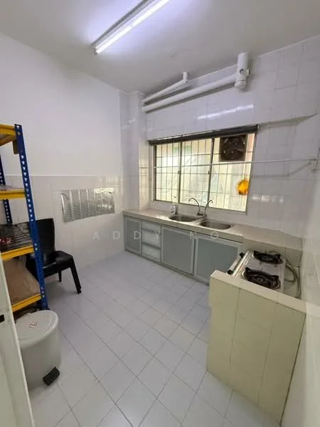 Kitchen features: white tiled walls, white tiled flooring, single-bowl stainless-steel sink, chrome pull-down faucet, two-burner gas hob, kitchen cabinetry with glass doors, window with metal grille, shelving unit, black chair, white round stool.