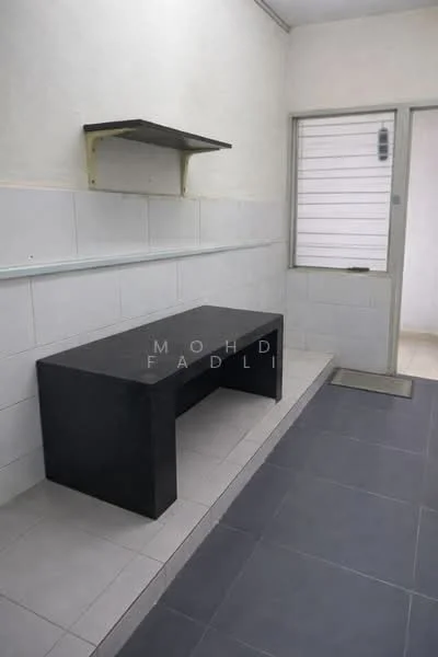 Laundry features: black countertop, white tiled walls, grey floor tiles, shelf above countertop, window with horizontal slats, door to outside, sink area, utility space.