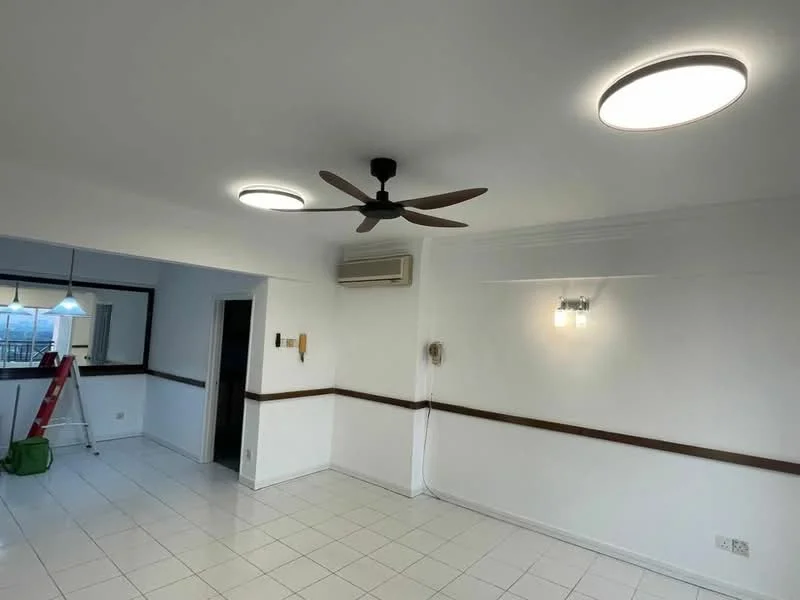 Living features: white painted walls, tile flooring, 5-blade ceiling fan with light, recessed LED downlights, wall-mounted air conditioning unit, wood trim along the wall, window with view to outside, ladder in background, pendant light fixture, decorative wall sconce; style: modern.
