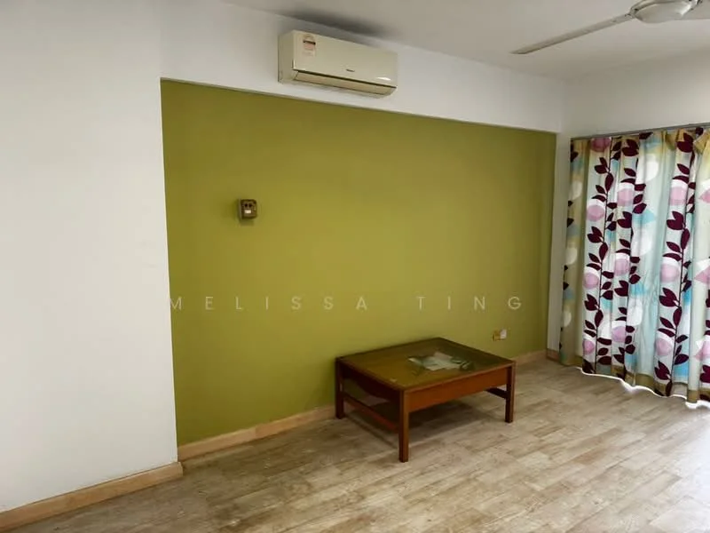 Room features: white painted walls, green accent wall, wooden flooring, ceiling fan, wall-mounted split AC, window with floral-patterned curtains, coffee table; style: modern.