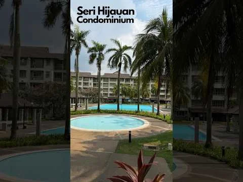 Exterior type: high-rise condominium; features: multiple swimming pools, landscaped garden, palm trees, manicured lawn, pool deck with loungers, surrounding greenery, modern architecture, balconies on upper floors; style: modern.