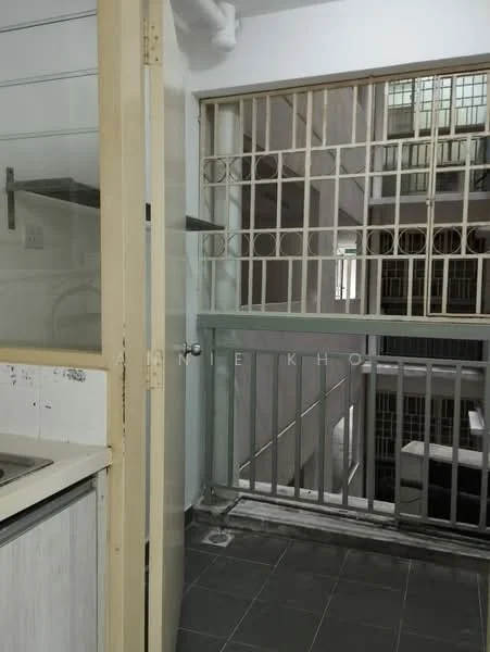 Room features: grey tiled flooring, metal security grille, glass sliding door, white painted walls, kitchen countertop, sink, open space leading to balcony.