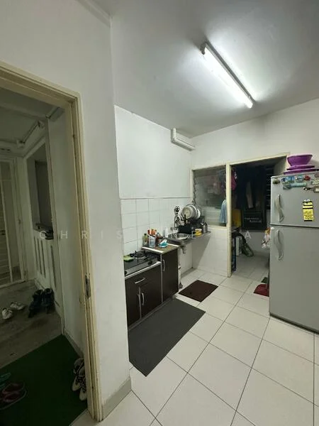 Kitchen features: white painted walls, tile flooring, fluorescent ceiling lights, stainless-steel fridge, kitchen sink, countertop with storage cabinets, black mat, grey mat.