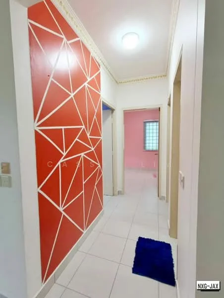 Hallway features: white painted walls, red accent wall with geometric pattern, white ceiling with crown moulding, recessed ceiling light, white tiled flooring, blue area rug; style: modern. Room features: pink painted walls, window with grid pattern, white door frames.