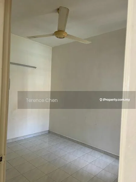 Room features: white painted walls, grey tiled flooring, ceiling fan, single wall-mounted clothes rail, no visible furniture, natural light from window, plain ceiling.